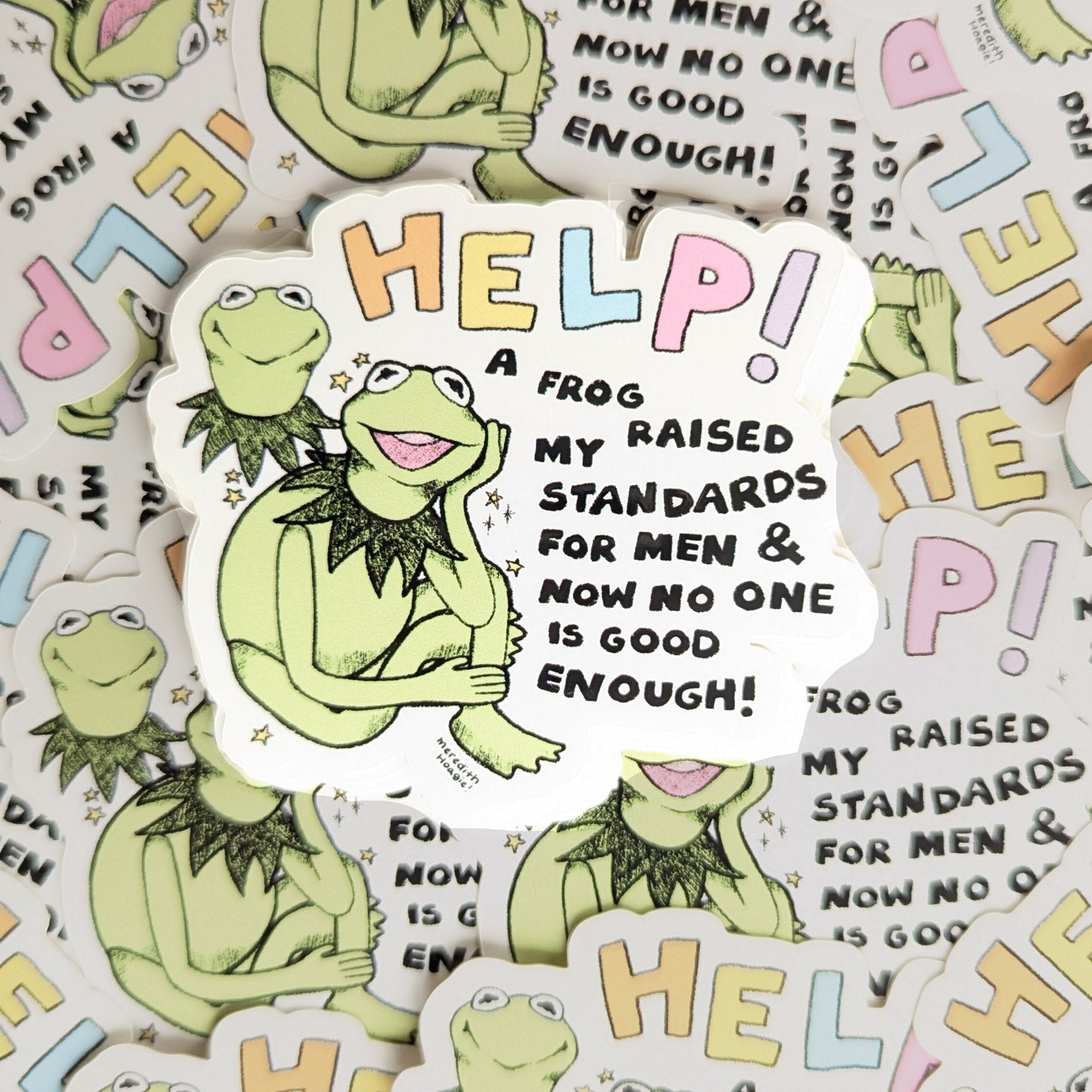 Help! A Frog Raised My Standards Sticker by Meredith Hoagie on top of a bunch of other stickers