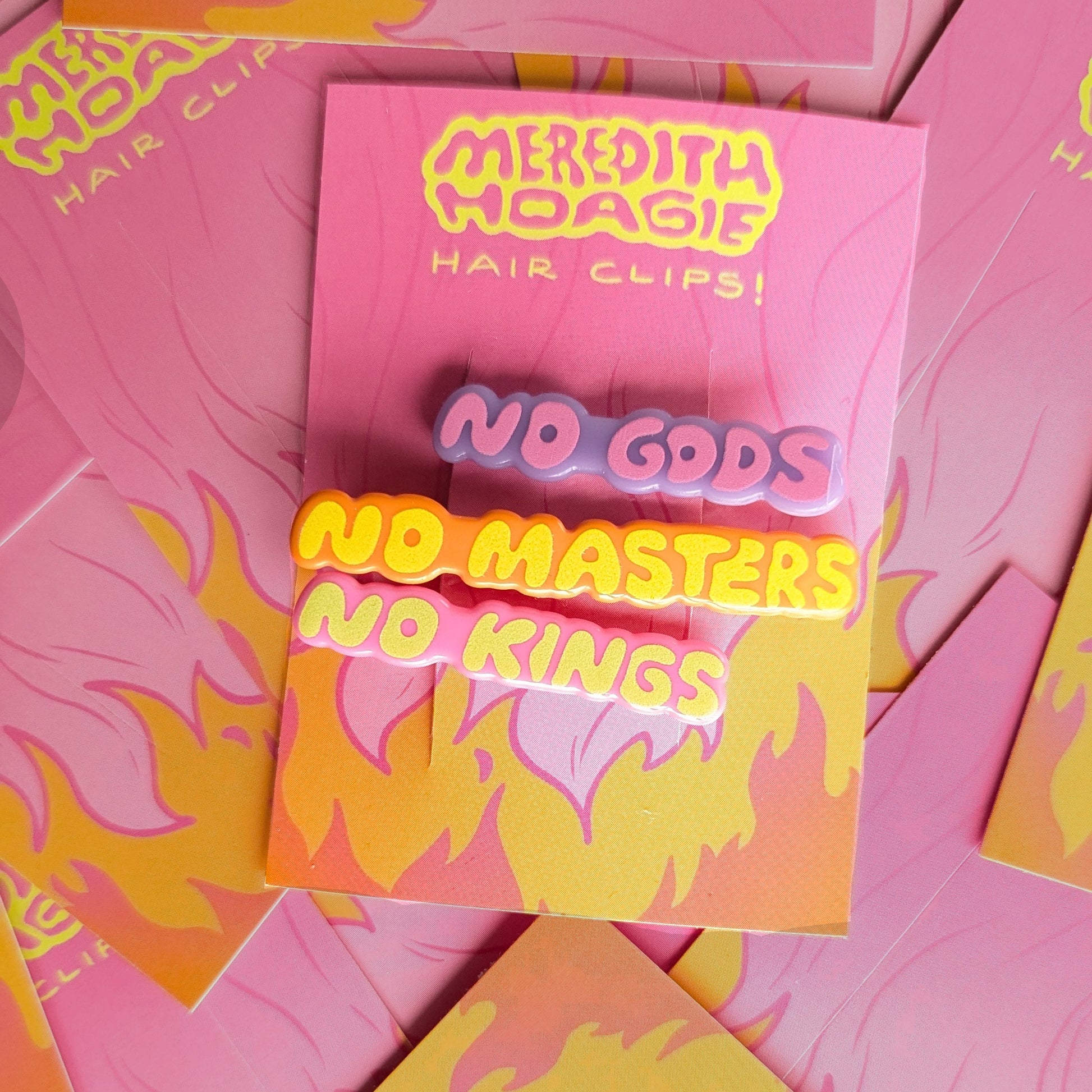 No Gods No Masters No Kings Hair Clips Meredith Hoagie on top of a bunch of cards
