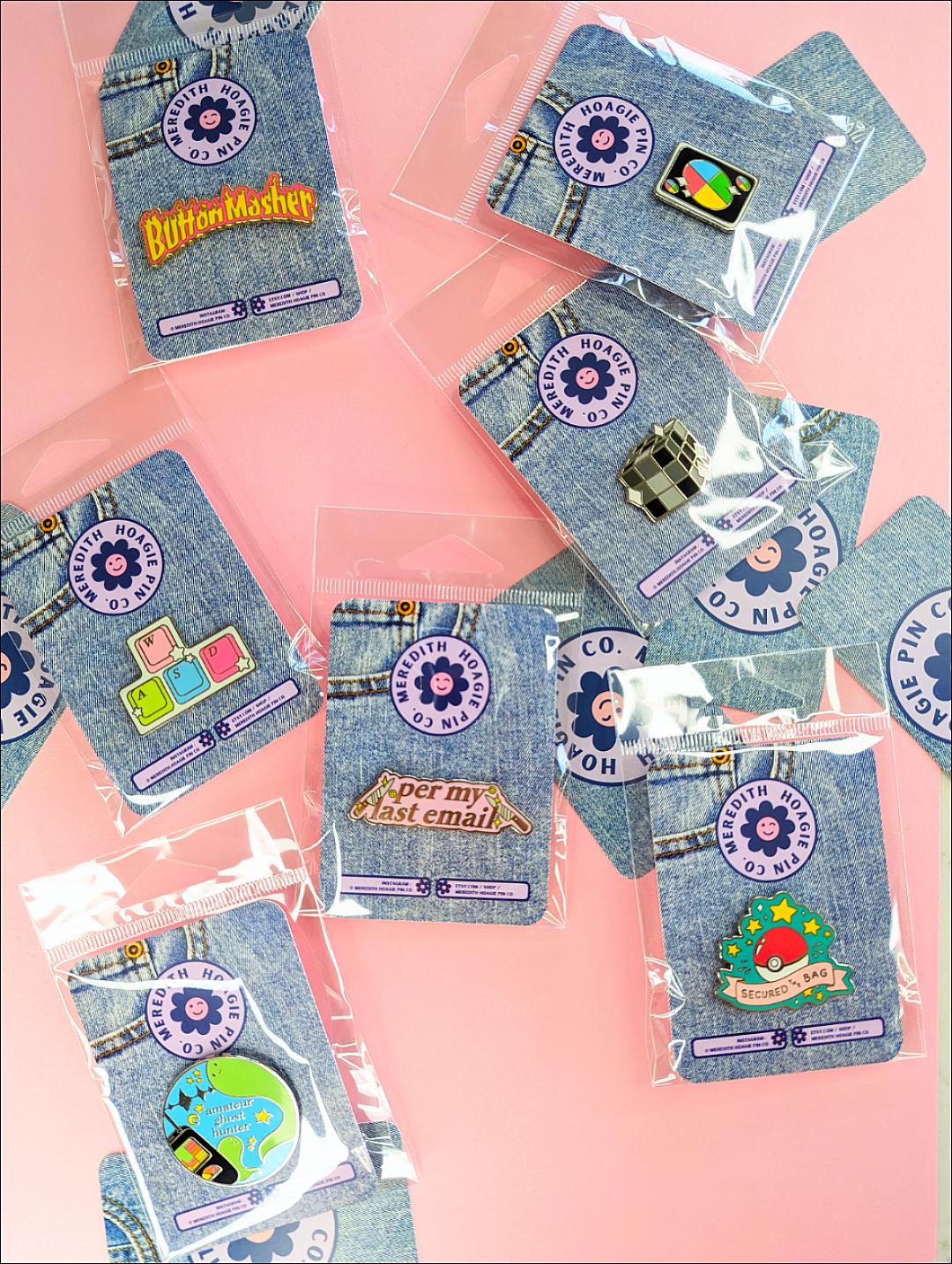 Meredith Hoagie Pin Co Enamel Pin Collection including the Secured the Bag Pokemon Enamel Pin