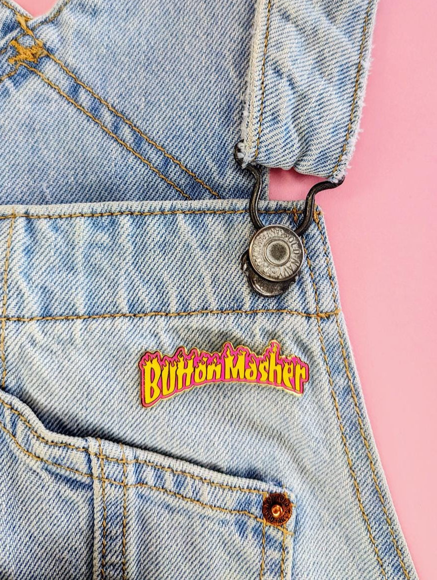 button masher gaming enamel pin on overalls, lifestyle