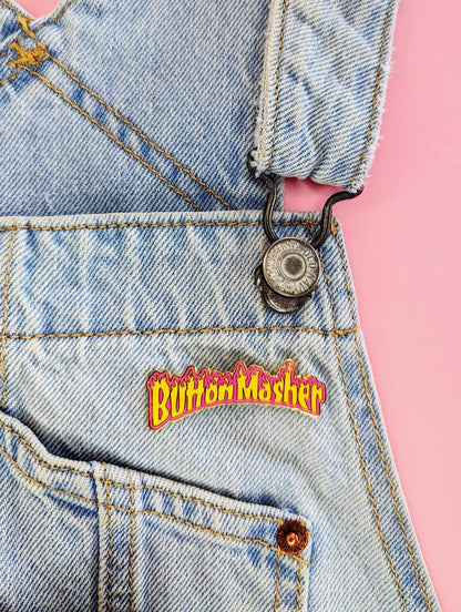 button masher gaming enamel pin on overalls, lifestyle